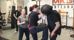 Martial arts instructor teaching bartenders how to defend themselves